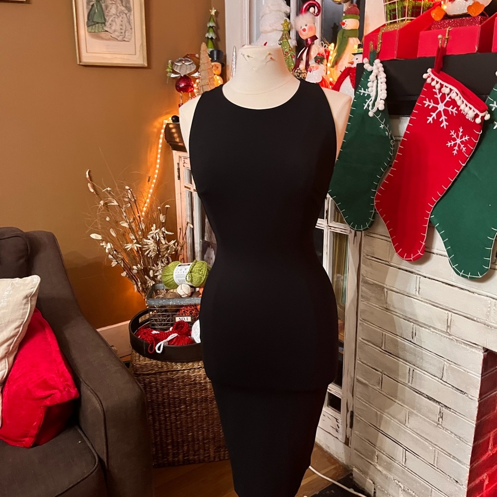 Fitted black dress with cutouts